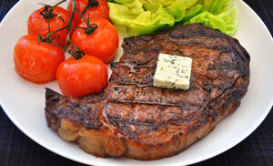 Grilled Ribeye Steak with Basil Butter & Blistered Tomatoes Recipe | D'Artagnan