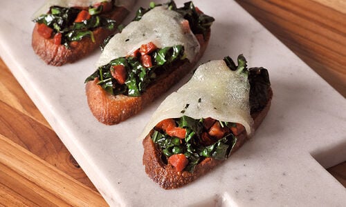 Spicy Chorizo and Sauteed Kale Toasts with Manchego Cheese Recipe | D’Artagnan