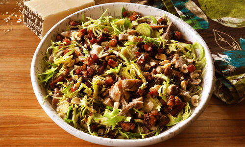 Shredded Brussels Sprouts Salad with Chicken Confit, Pancetta & Hazelnuts Recipe | D’Artagnan