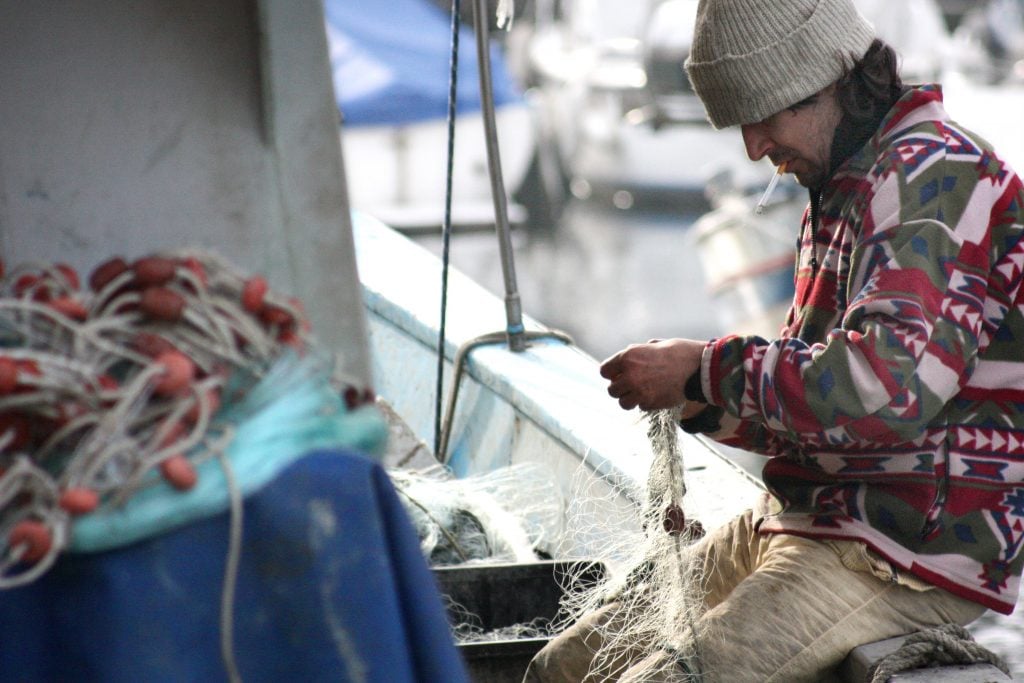 Fisherman fishing boat winter